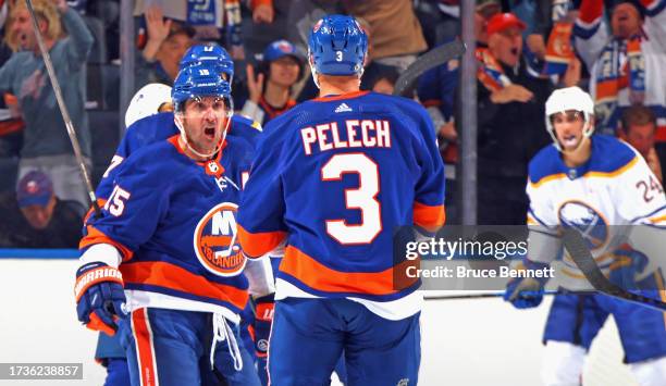 Cal Clutterbuck of the New York Islanders celebrates a goal at 13:40 of the third period against the Buffalo Sabres at UBS Arena on October 14, 2023...