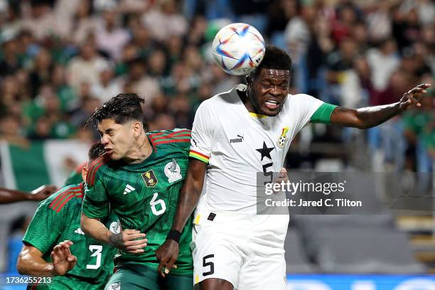 Thomas Partey of Ghana attempts a header against Gerardo Arteaga of México during the first half of their match at Bank of America Stadium on October...