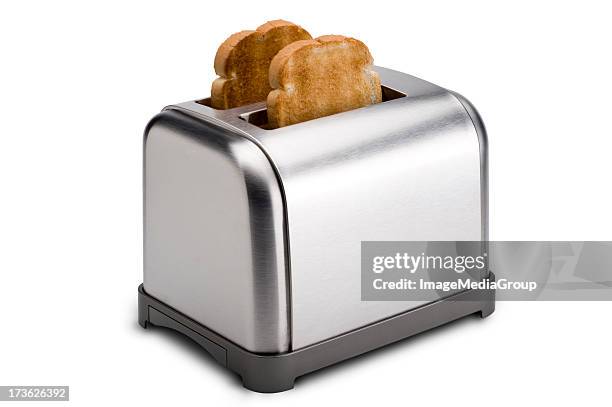 stainless toaster with toast - using toaster stock pictures, royalty-free photos & images