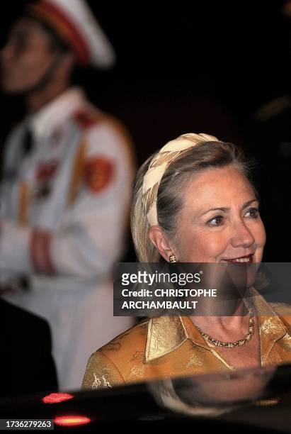 Secretary of State Hillary Clinton smiles as she walks on the tarmac upon her arrival to Vietnam to take part in the 17th ASEAN Summit and Related...