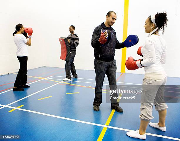 teenage students in a self defense class - boxing girls stock pictures, royalty-free photos & images