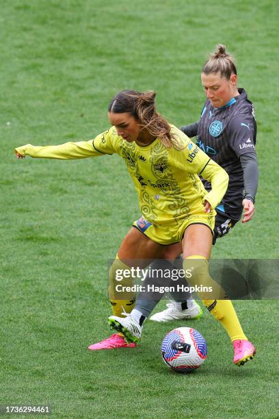 Macey Fraser of the Phoenix is challenged by Rhianna Pollicina of Melbourne City during the round one A-League Women match between Wellington Phoenix...