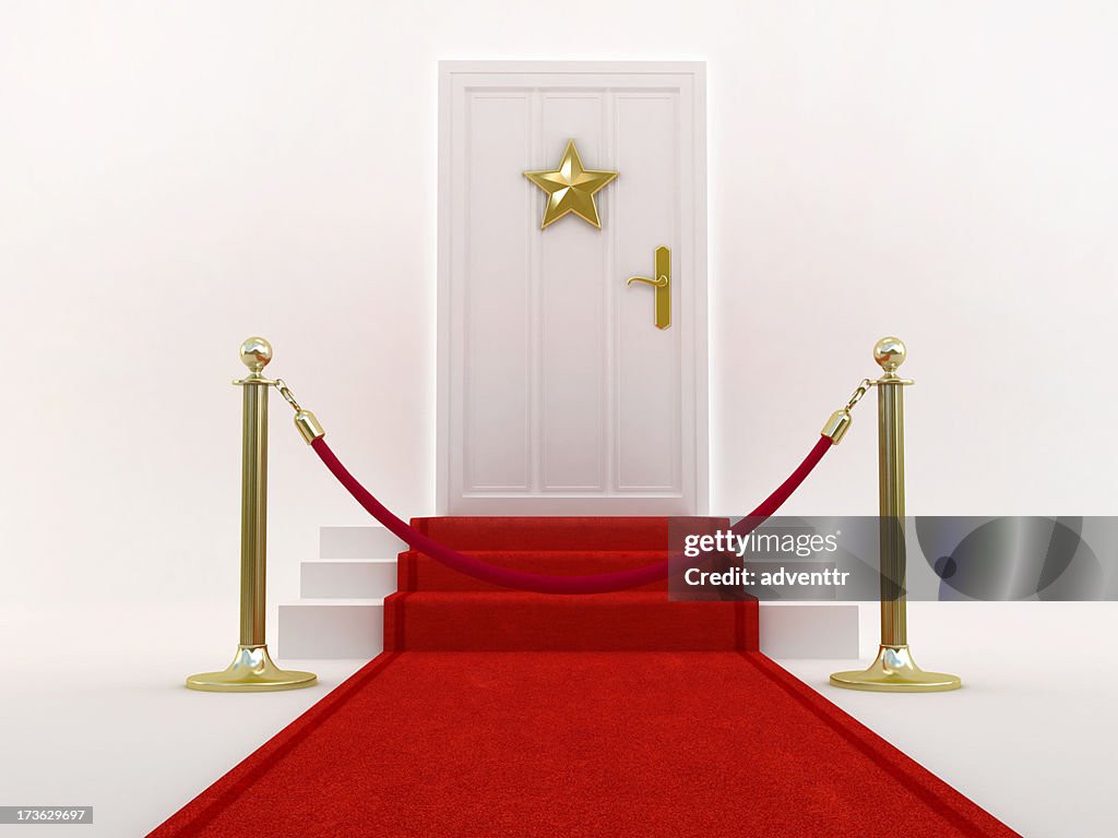Red carpet leading to the door with star shape