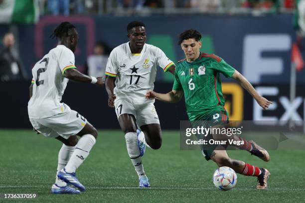 Gerardo Arteaga of Mexico and Ernest Appiah of Ghana battle for the ball during the friendly match between Ghana and Mexico at Bank of America...