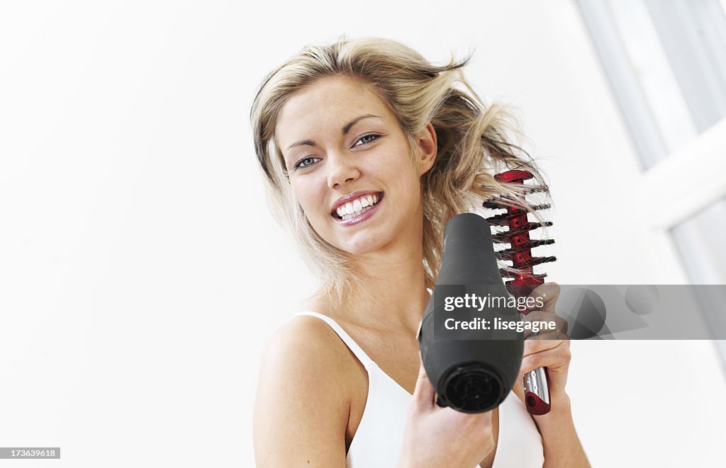 Woman hairdrying