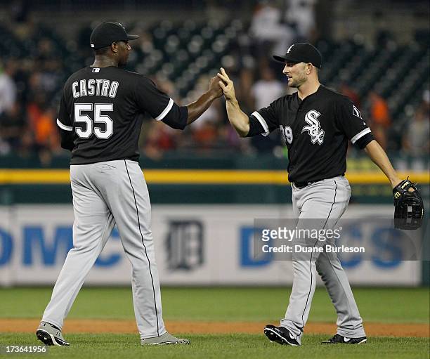 Pitcher Simon Castro of the Chicago White Sox and Casper Wells celebrate a win over the Detroit Tigers at Comerica Park on July 9, 2013 in Detroit,...