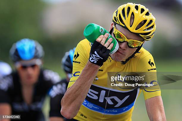 Chris Froome of Great Britain riding for Sky Procycling takes drink as he defends the overall race leader's yellow jersey during stage sixteen of the...
