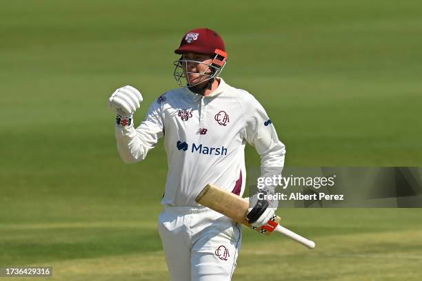 Matthew Renshaw of Queensland celebrates his century during the Sheffield Shield match between Queensland and Victoria at Great Barrier Reef Arena,...