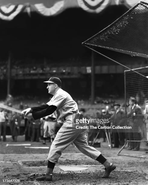 Aloysius H. Simmons of the Cincinnati Reds swinging a bat in 1939.