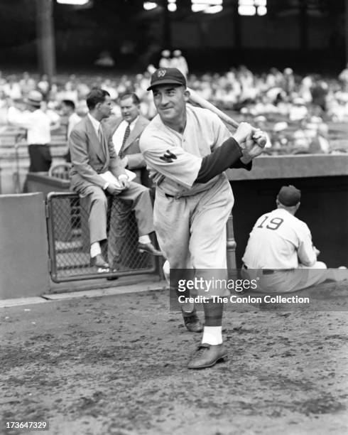 Aloysius H. Simmons of the Washington Senators swinging a bat in 1937.