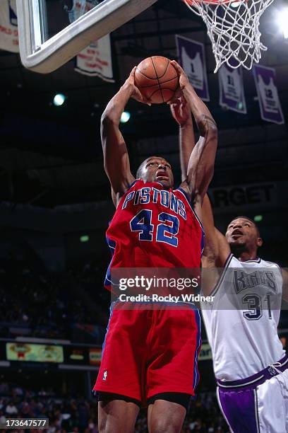 Theo Ratliff of the Detroit Pistons rises for a dunk against Duane Causwell of the Sacramento Kings during a pre-season game played on October 17,...