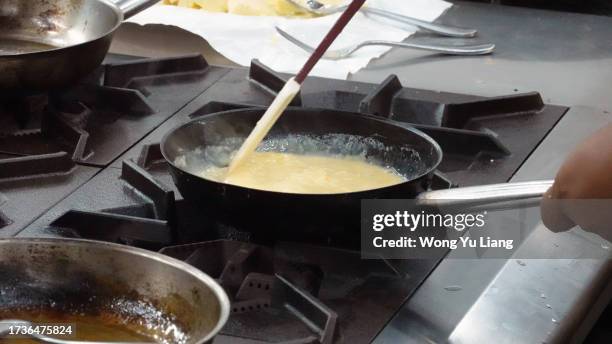 egg being scrambled - scrambled eggs stock pictures, royalty-free photos & images