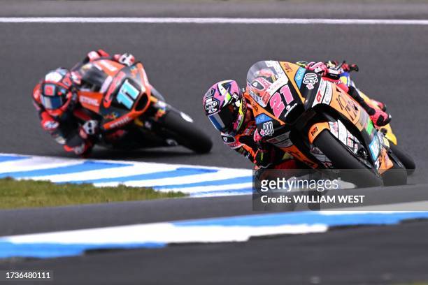 Speed Up's Spanish rider Alonso Lopez leads Pons Wegow Los40's Spanish rider Sergio Garcia during the Moto2 class qualifying session of the MotoGP...