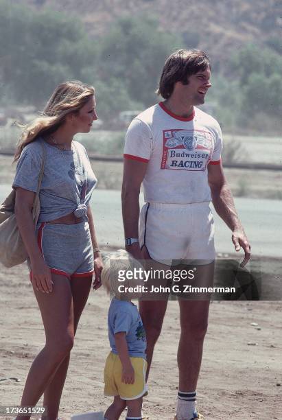 Portrait of media personality and Olympic Decathlon gold medalist Bruce Jenner on beach with wife Linda, and son Burt during photo shoot. Malibu, CA...