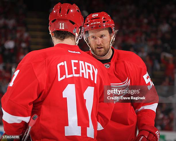 Daniel Cleary and Niklas Kronwall of the Detroit Red Wings talk before a face-off during Game Six of the Western Conference Semifinals against the...