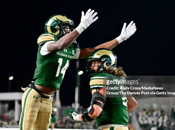 Colorado State Rams wide receiver Tory Horton , left, celebrates with Colorado State Rams tight end Dallin Holker , left, after Dallin caught a Hail...