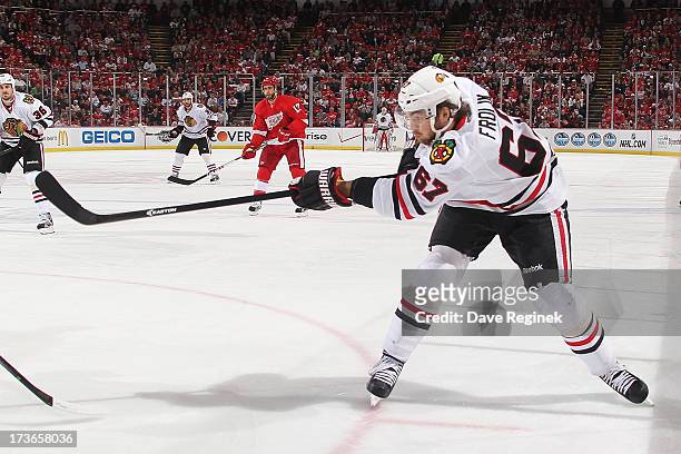 Michael Frolik of the Chicago Blackhawks shoots the puck during Game Six of the Western Conference Semifinals against the Detroit Red Wings during...