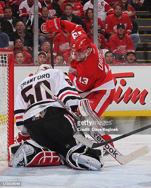 Pavel Datsyuk of the Detroit Red Wings looks for the rebound from Corey Crawford of the the Chicago Blackhawks during Game Six of the Western...