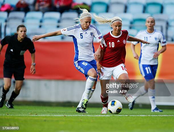 Finland's Tiina Saario vies with Denmark's Pernille Harder during the UEFA Women's EURO 2013 group A soccer match between Denmark and Finland, at...