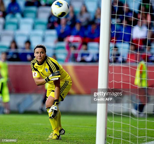 Finland's goalkeeper Minna Meriluoto watches the ball as it crosses the goal line during the UEFA Women's EURO 2013 group A soccer match between...