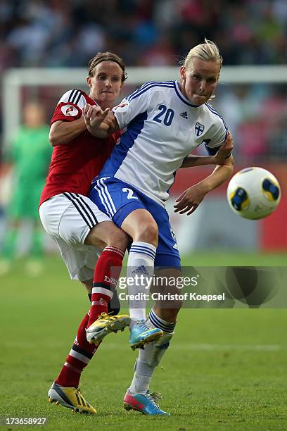 Mia Brogaard of Denmark challenges Annica Sjoelund of Finland during the UEFA Women's EURO 2013 Group A match between Denmark and Finland at Gamla...