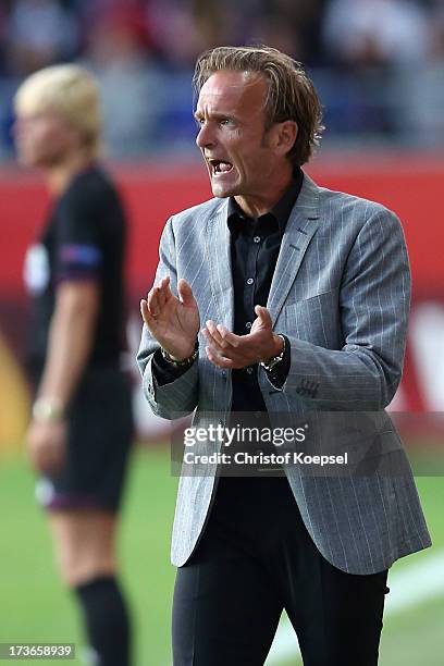 Head coach Kenneth Heiner-Moeller of Denmark shouts at his team during the UEFA Women's EURO 2013 Group A match between Denmark and Finland at Gamla...