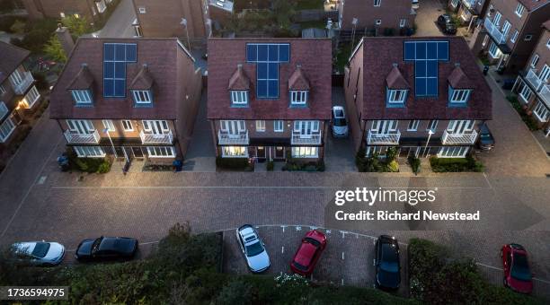 solar powered housing at dusk - solar street light stock pictures, royalty-free photos & images