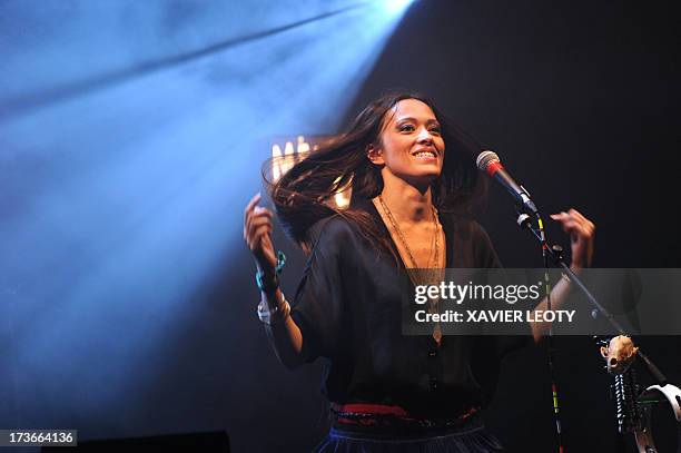 French singer Mai Lan performs on stage on July 16, 2013 during the Francofolies music festival in La Rochelle, western France. AFP PHOTO / XAVIER...