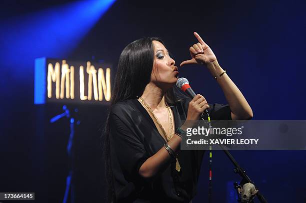 French singer Mai Lan performs on stage on July 16, 2013 during the Francofolies music festival in La Rochelle, western France. AFP PHOTO / XAVIER...