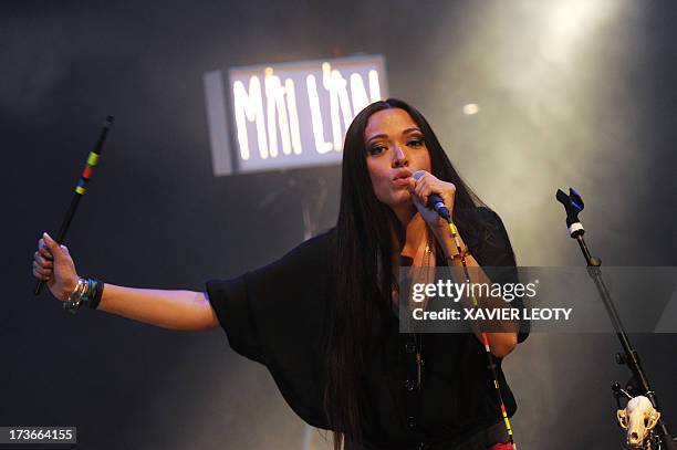 French singer Mai Lan performs on stage on July 16, 2013 during the Francofolies music festival in La Rochelle, western France. AFP PHOTO / XAVIER...