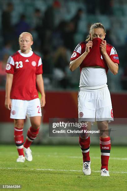 Karoline Smidt Nielsen and Mariann Knudsen of Denmark look dejected after the UEFA Women's EURO 2013 Group A match between Denmark and Finland at...