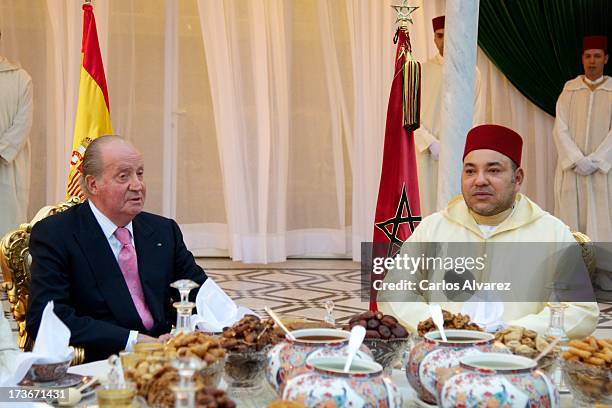 King Mohammed VI of Morocco receives King Juan Carlos of Spain at the Royal Palace for a official dinner during the second day of his visit to...