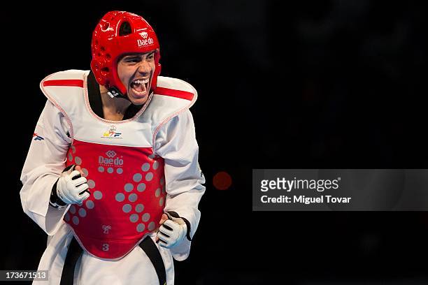 Uriel Adriano of Mexico celebrates after winning against Raul Martinez of Spain during a men's 74kg combat as part of WTF World Taekwondo...