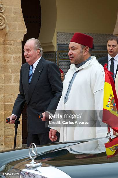 King Mohammed VI of Morocco receives King Juan Carlos of Spain at the Royal Palace for a official dinner during the second day of his visit to...