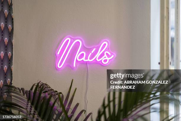 nails manicure spa neon pink sign - nail salon interior stock pictures, royalty-free photos & images