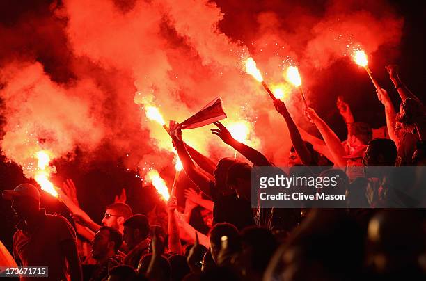 Galatasaray fans light flares during the pre season friendly match between Notts County and Galatasaray at Meadow Lane on July 16, 2013 in...