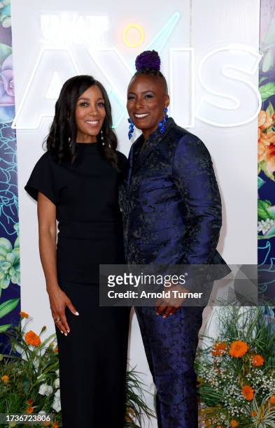 Shaun Robinson and Collette Bowers Zinn attend the 2023 Axis Glow Up Gala at The SoLa Beehive on October 14, 2023 in Los Angeles, California.