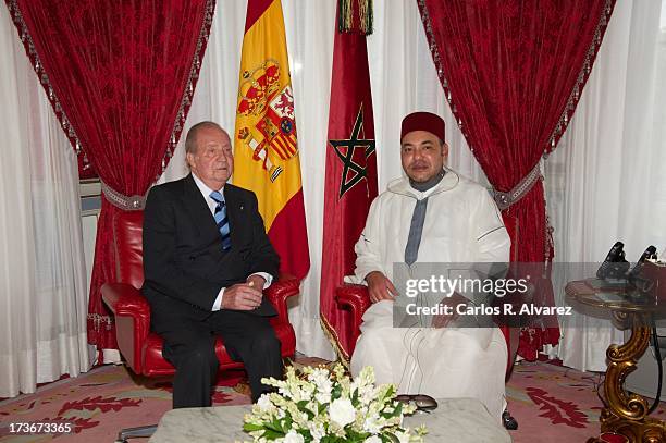 King Mohammed VI of Morocco receives King Juan Carlos of Spain at the Royal Palace during the second day of his visit to Morocco on July 16, 2013 in...