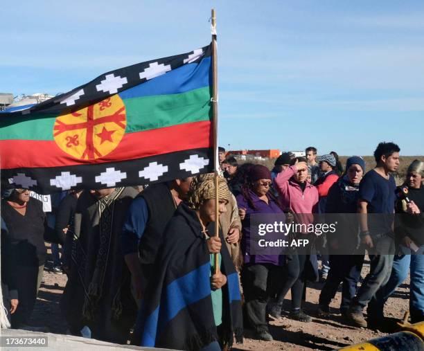 Mapuche indigenous people protest against the signing of a production agreement between Argentinian oil company YPF and US Chevron, as they occupy...
