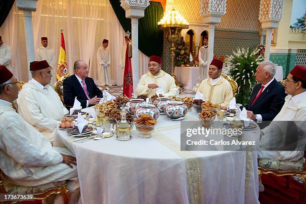 King Mohammed VI of Morocco and his brother Prince Moulay Rachid receive King Juan Carlos of Spain at the Royal Palace for a official dinner during...