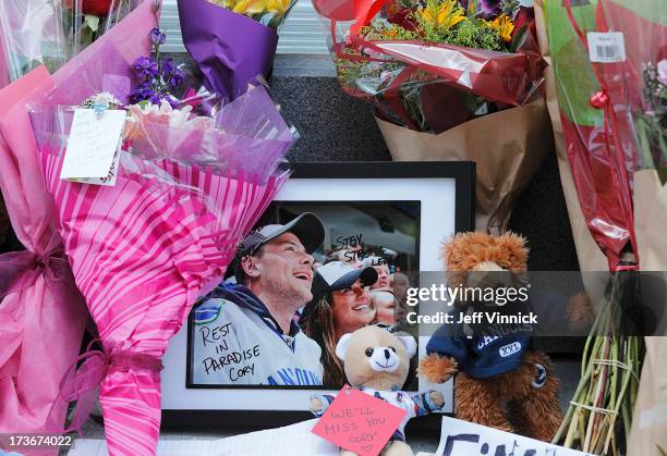 Flowers and photos left by mourning fans occupy a memorial to deceased actor Cory Monteith outside the Fairmont Pacific Rim Hotel on July 16, 2013 in...