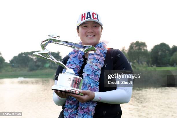 Angel Yin of the United States poses with the Buick LPGA Shanghai Champion Trophy after winning the Buick LPGA Shanghai at Shanghai Qizhong Garden...