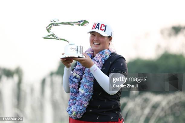 Angel Yin of the United States poses with the Buick LPGA Shanghai Champion Trophy after winning the Buick LPGA Shanghai at Shanghai Qizhong Garden...