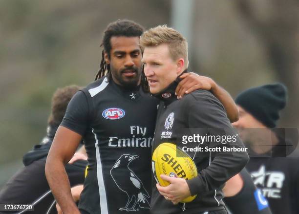 Harry O'Brien of the Magpies and Nathan Buckley the coach of the Magpies embrace during a Collingwood Magpies AFL training session at Olympic Park on...