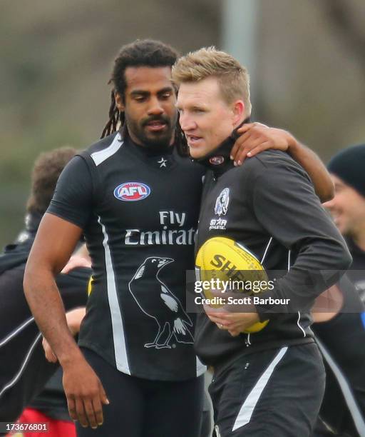 Harry O'Brien of the Magpies and Nathan Buckley the coach of the Magpies embrace during a Collingwood Magpies AFL training session at Olympic Park on...