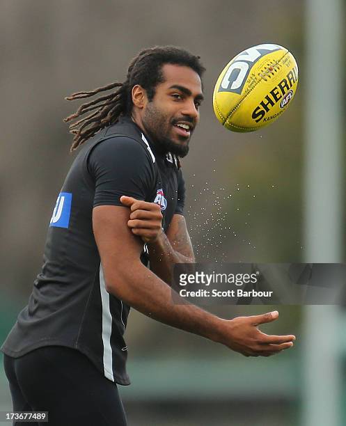 Harry O'Brien of the Magpies passes the ball during a Collingwood Magpies AFL training session at Olympic Park on July 17, 2013 in Melbourne,...