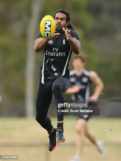 Harry O'Brien of the Magpies catches the ball during a Collingwood Magpies AFL training session at Olympic Park on July 17, 2013 in Melbourne,...