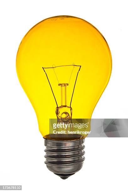 yellow light bulb isolated on white - gloeidraad stockfoto's en -beelden