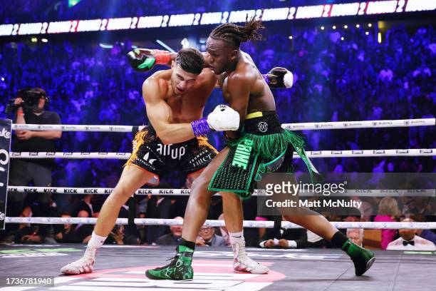And Tommy Fury exchange punches during the Misfits Cruiserweight fight between KSI and Tommy Fury at AO Arena on October 14, 2023 in Manchester,...