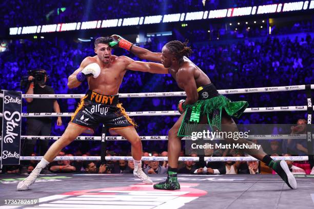 And Tommy Fury exchange punches during the Misfits Cruiserweight fight between KSI and Tommy Fury at AO Arena on October 14, 2023 in Manchester,...